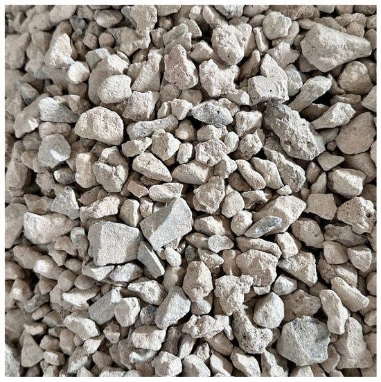Close-up of irregular pale gray crushed concrete aggregate pieces